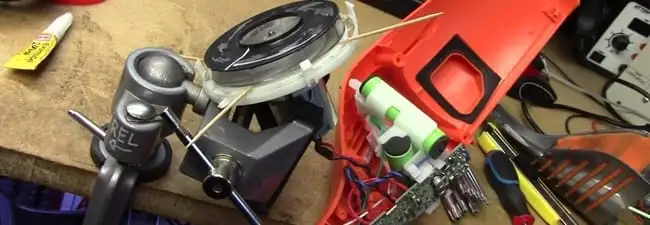 Vacuum cleaner repair parts and tools on a workbench in Tempe, AZ